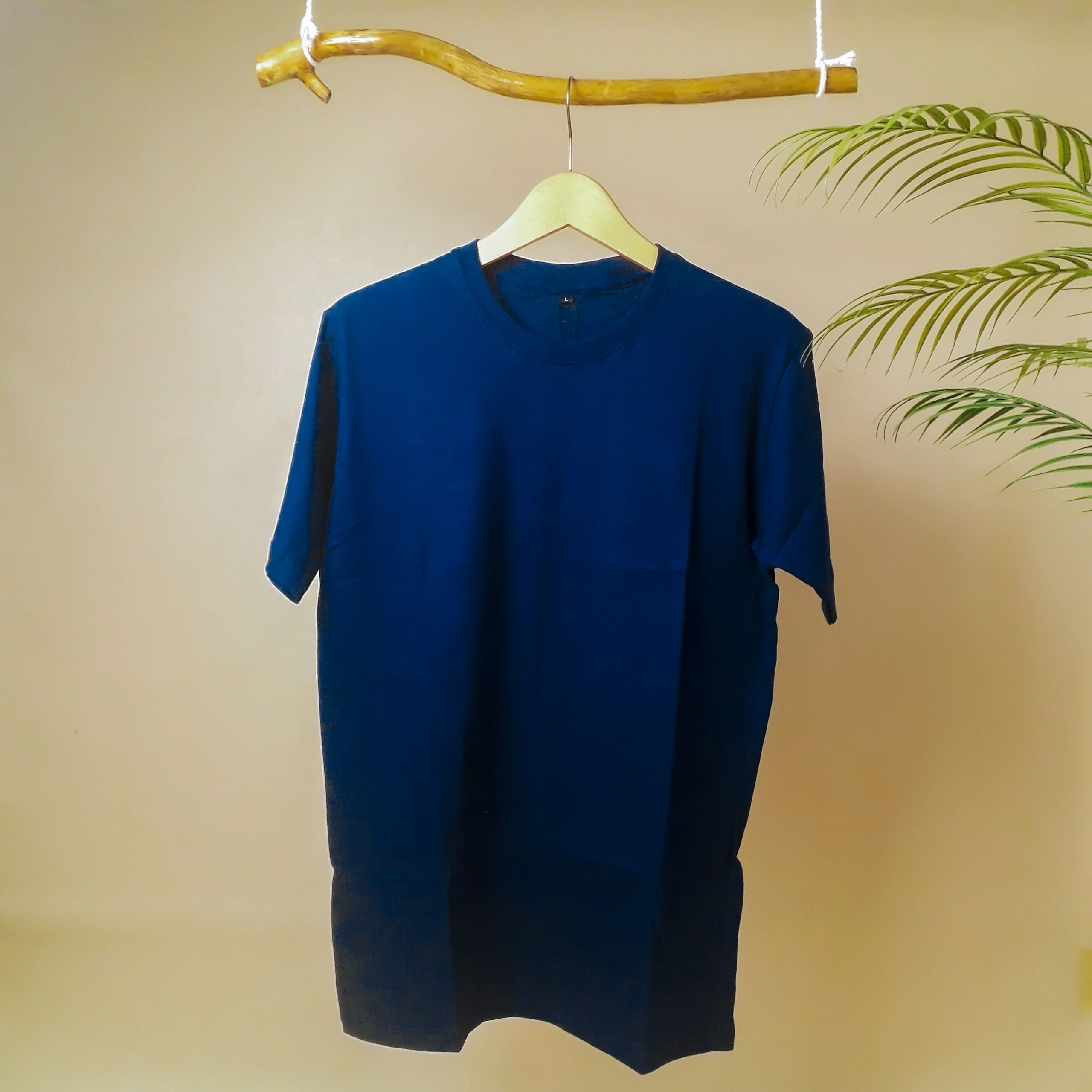 Folded premium t-shirt on a neutral background