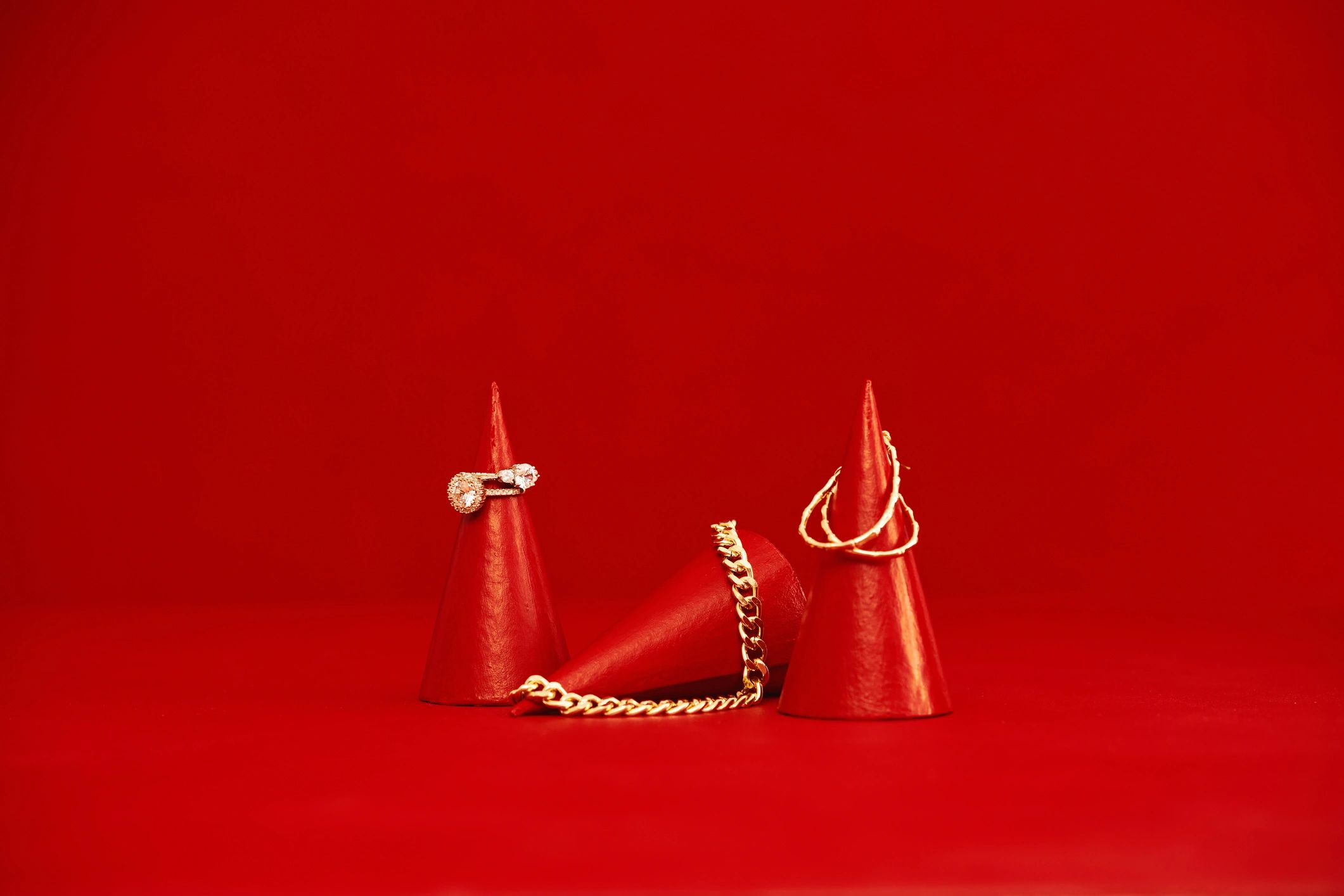 Women's jewelry on red display cones