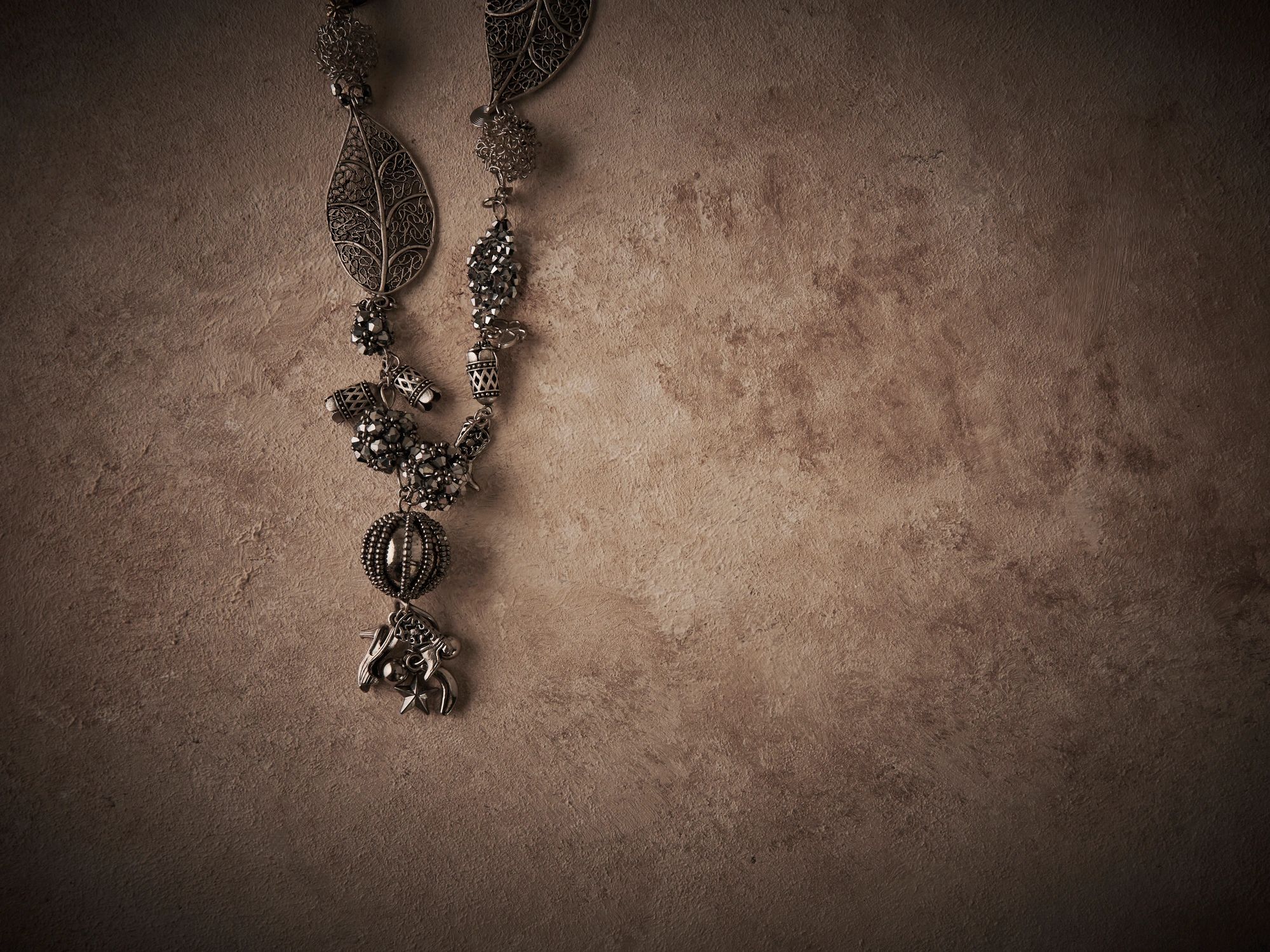 Elegant diamond jewelry set on textured background