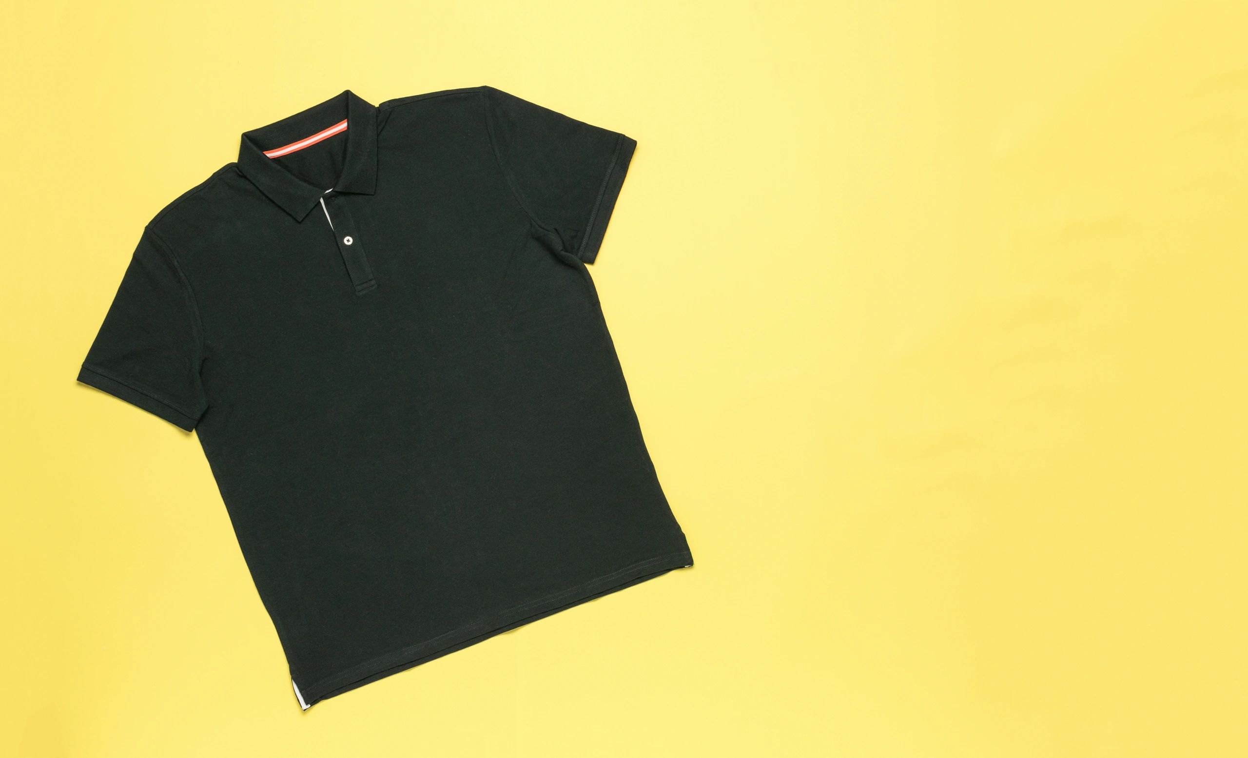 Men's polo shirt on a yellow background
