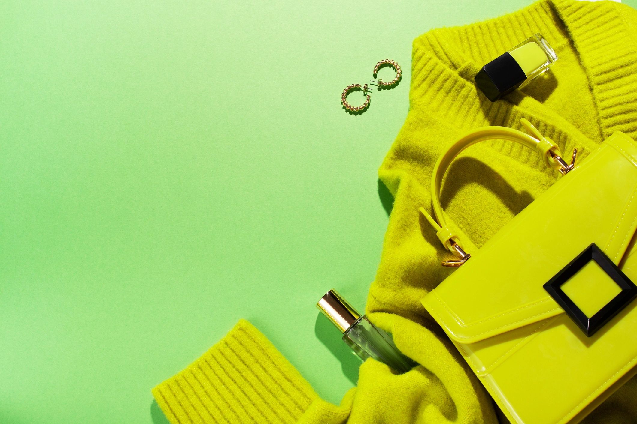 Fashion accessories flat lay in lime green color