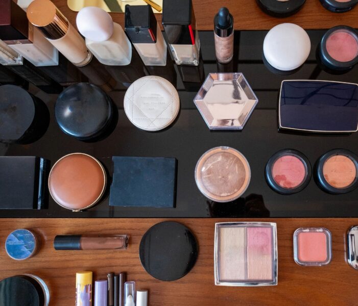 Beauty cosmetics collection flat lay arranging on black background