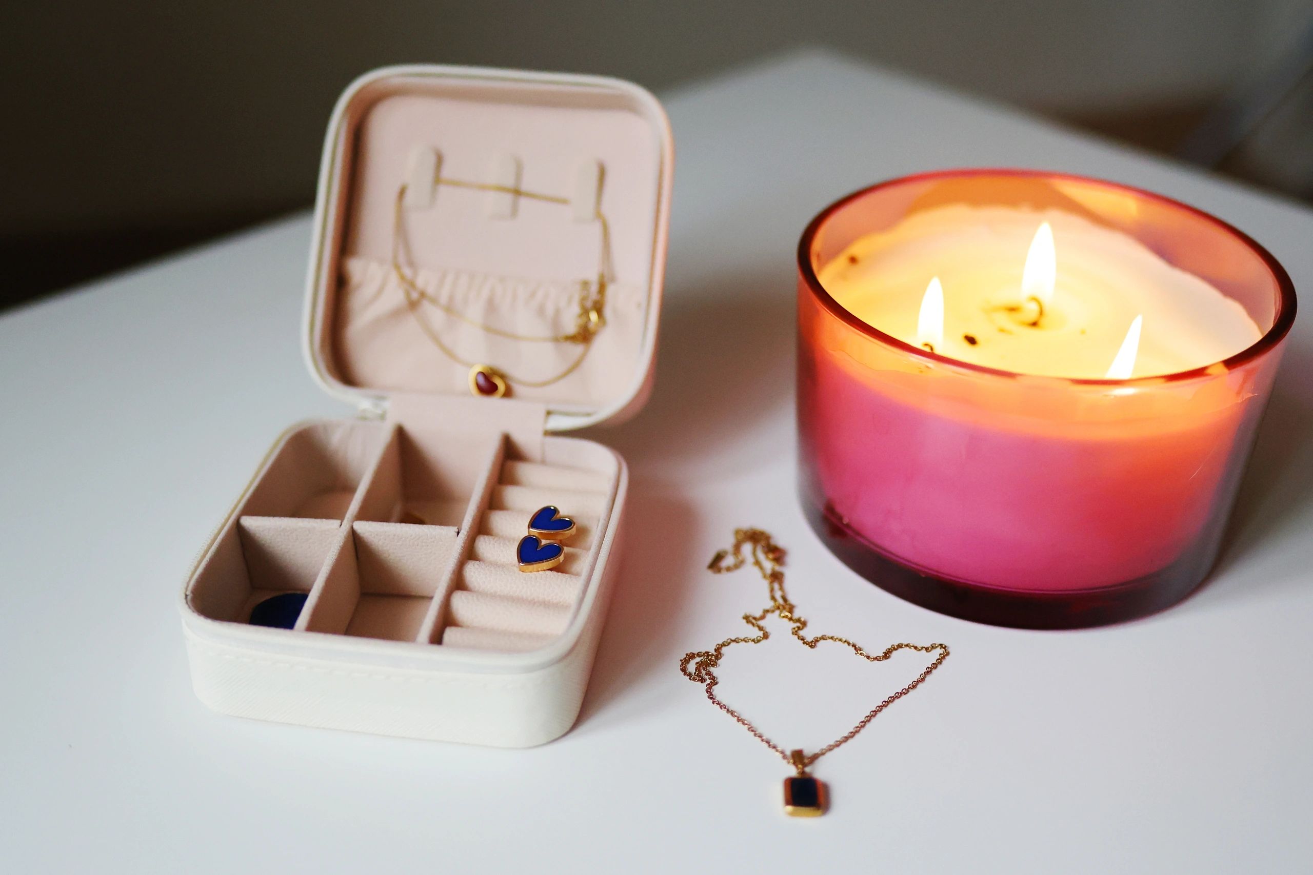 Jewelry box with gold accessories and candle