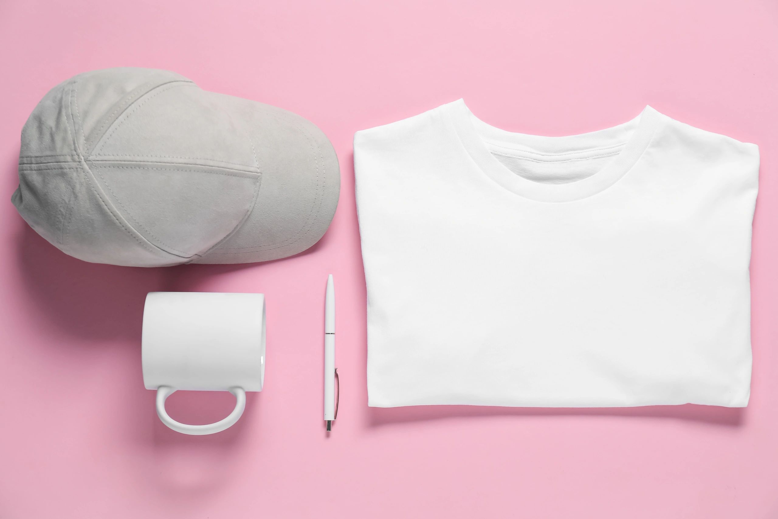 Blank apparel items on pink background for branding