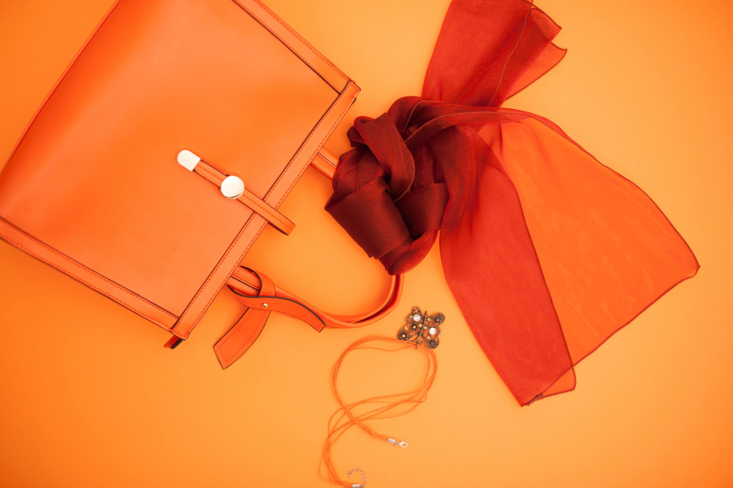 Personal accessories on orange background